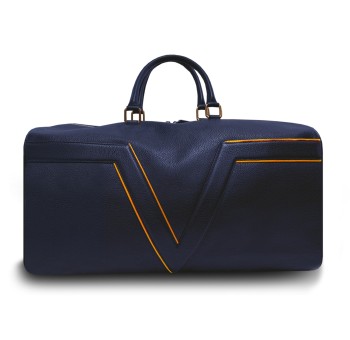 Le sac de voyage BréVent, élégant et fonctionnel, dans sa version en cuir bleu, liseré orange.