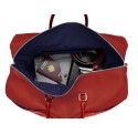 Intérieur sac de voyage cuir rouge liseré bleu blanc.