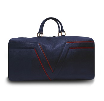 Le sac de voyage BréVent, élégant et fonctionnel, dans sa version en cuir bleu, liseré rouge.