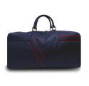 Le sac de voyage BréVent, élégant et fonctionnel, dans sa version en cuir bleu, liseré rouge.